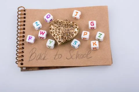 Back to school theme with letter cubes Stock Photos