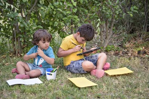 Back to school. Two happy and cheerful children, a schoolboy with notebooks and Stock Photos