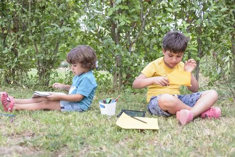 Back to school. Two happy and cheerful children, a schoolboy with notebooks and Stock Photos
