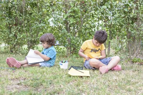 Back to school. Two happy and cheerful children, a schoolboy with notebooks and Stock Photos