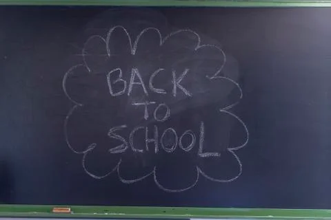 Back to school written on a blackboard Fotos de archivo