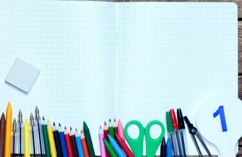 Back to school.background.Various school supplies are on the paper sheet Stock Photos