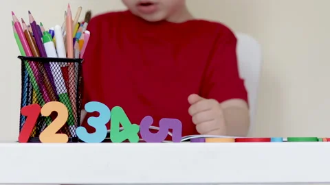 Back to school,education,learning concept.kid at table with pencils is drawing. 動画素材 199574893