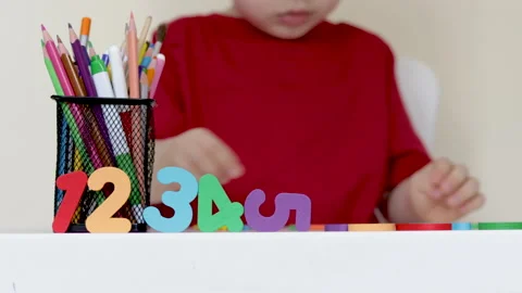 Back to school,education,learning concept.kid at table with pencils is drawing. Video stock 199575042