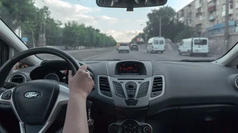 Back seat POV view driving car throw street with trafic Stock Footage 67146151