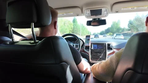 Back-seat View of Driver and Passenger on a Highway Vídeo Stock 347683293
