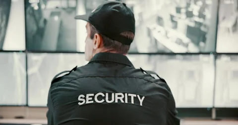 Back, security guard and man with inspection, video surveillance and pc with Stock Footage 303942392