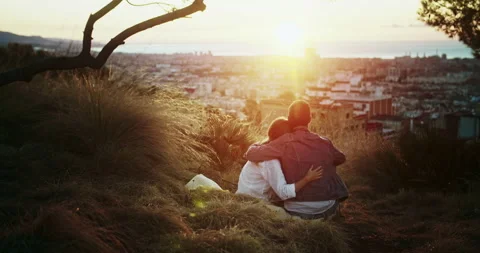 Back shot of affectionate young couple dating at happy summer moment sunrise Stock Footage 140736696