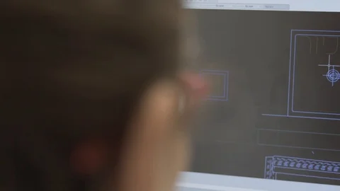 Back shot of an architect designer working on autocad sketch Stock Footage 99996144