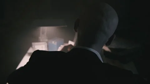 Back shot of Bald accountant dealing with paperwork Stock Footage 258480076