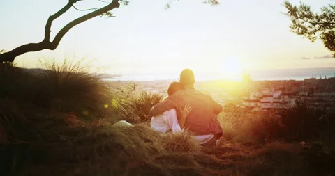 Back shot of charming sunrise summer moment of affectionate couple enjoy viewing Stock Footage 140736579