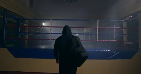 Back shot of confident athletic man entering empty gym putting sports bag down 库存影片 150062365