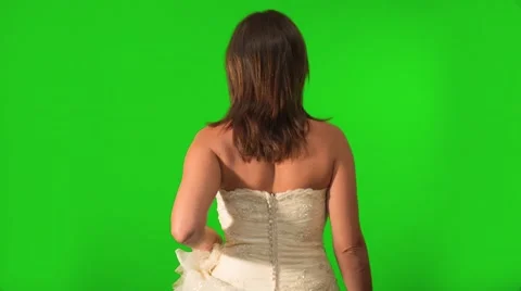 Back shot on Green Screen of bride as she holds her dress Stockbeeldmateriaal 43159697
