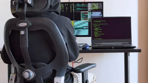 Back shot of a man typing on a keyboard and working as hacker clip 2 Stock Footage 146606570