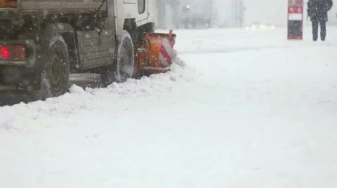 Back shot of plower cleaning up snow Stock Footage 59643815
