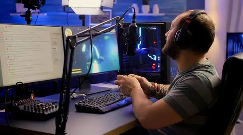 Back shot of pro streamer playing graphics cyber space Stock Photos