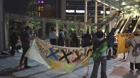 Back shot of protest against 2020 Tokyo Olympics - 4K Stock Footage 154898005