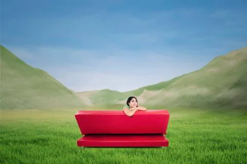 Back shot of red sofa with pensive woman outdoor Stock Illustration