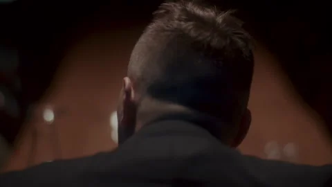 Back shot of A sad man sitting alone at the table Vídeo Stock 258333562