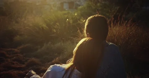 Back shot of sincere romantic couple moment embracing together enjoying sunset Stock Footage 138926474