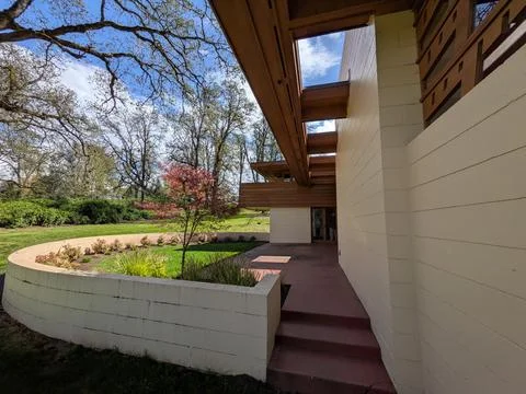 Back side of the Gordon House features red flooring, exterior stairways Photos