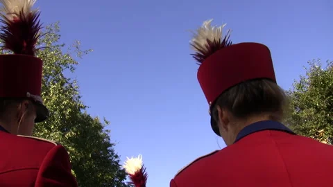 Back side of heads two women brass orchestra musicians wearing red uniform hats Stockbeeldmateriaal 342241948