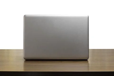 Back side laptop or notebook on wood table white background. back side laptop Stock Photos