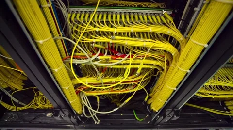 Back Side Of Modern Working Data Center Servers With Yellow Cable - Tilt Up 스톡 동영상 57724630