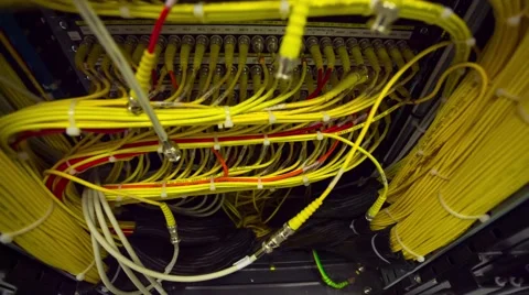 Back Side Of Modern Working Data Center Servers With Yellow Cable - Tilt Up 스톡 동영상 57725447