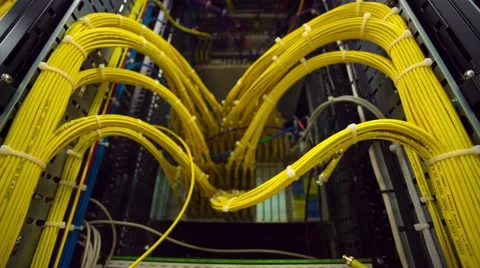 Back Side Of Modern Working Data Center Servers With Yellow Cable - Tilt Down 스톡 동영상 57727327