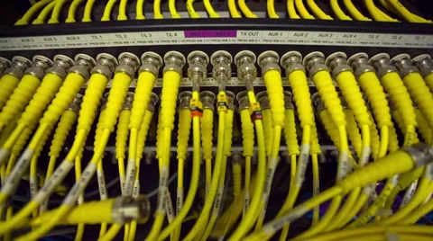 Back Side Of Modern Working Data Center Servers With Yellow Cable - Tilt Up 스톡 동영상 57728140