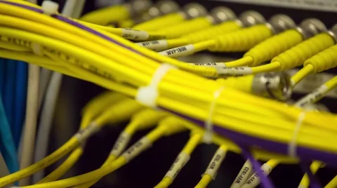 Back Side Of Modern Working Data Center Servers With Yellow Cable - Pan Right 库存影片 57729211