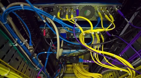 Back Side Of Modern Working Data Center Servers With Yellow Cable - Tilt Up Vidéo 57733495