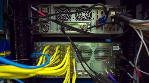 Back Side Of Modern Working Data Center Servers With Yellow Cable - Tilt Down 스톡 동영상 57733801