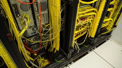 Back Side Of Modern Working Data Center Servers With Yellow Cable - Tilt Up 스톡 동영상 58598888