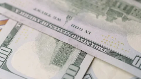 Back side of one hundred dollar banknotes rotating in detailed macro scene .. Stock Footage 323975363