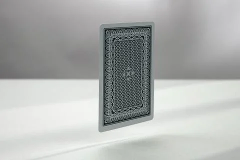 Back side of playing card. a dark background	 Stock Photos