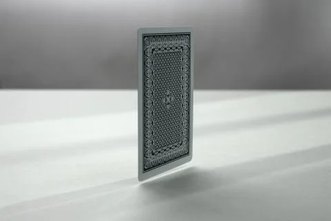 Back side of playing card. a dark background	 Stock Photos