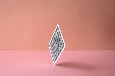 Back side of playing card on pink background.	 Stock Photos