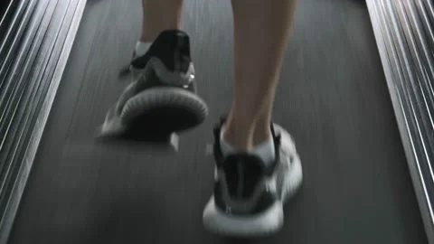 Back side of shoes athletic having workout on treadmill. Stock Footage 152365471