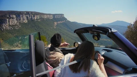 Back side shoot of tourist couple in car enjoying to view beautiful nature of Stock Footage 108441135