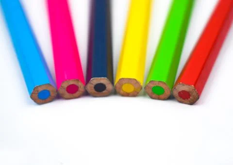 Back side of six different colored wood pencil crayons on a white background Stock Photos