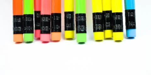 Back side of some different colored wood pencil crayons with rubber attached Stock Photos