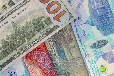 Back side of US $100 bill with Kazakhstani tenge banknotes. Foreign exchang.. Stock Photos