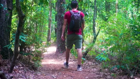 A back side view of one young man with drawstring bag backpack walking Video stock 202078950