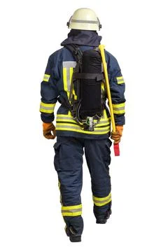 Back side view of walking firefighter in fire-proof uniform Stock Photos