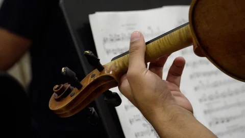 Back side of a violin and violinist playing Stock Footage 95817103
