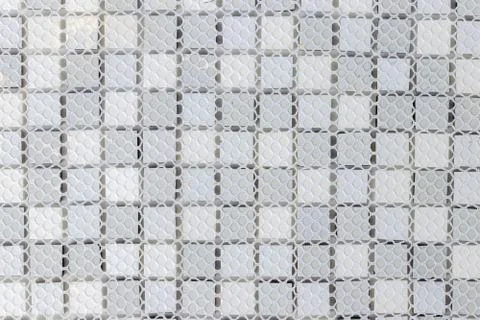 Back side of White, Grey and black ceramic mosaic wall tiles texture for bath Stock Photos