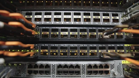 Back side of working data servers with flashing LED lights 動画素材 116244893