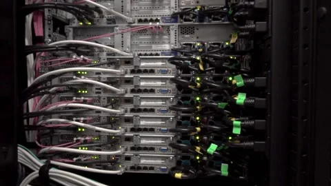 Back side of working data servers with flashing LED lights. Video stock 169475617